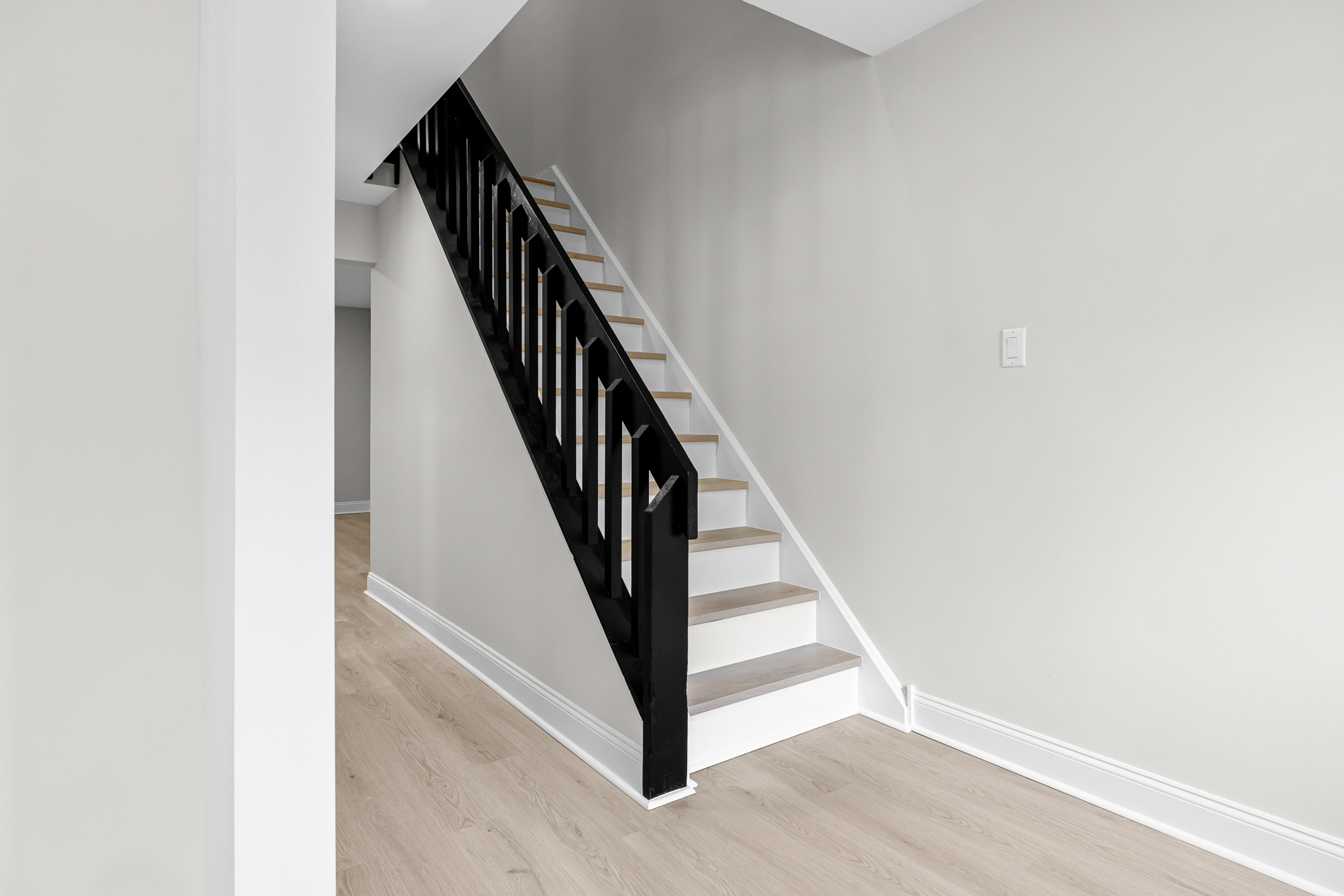Interior staircase with modern black railing