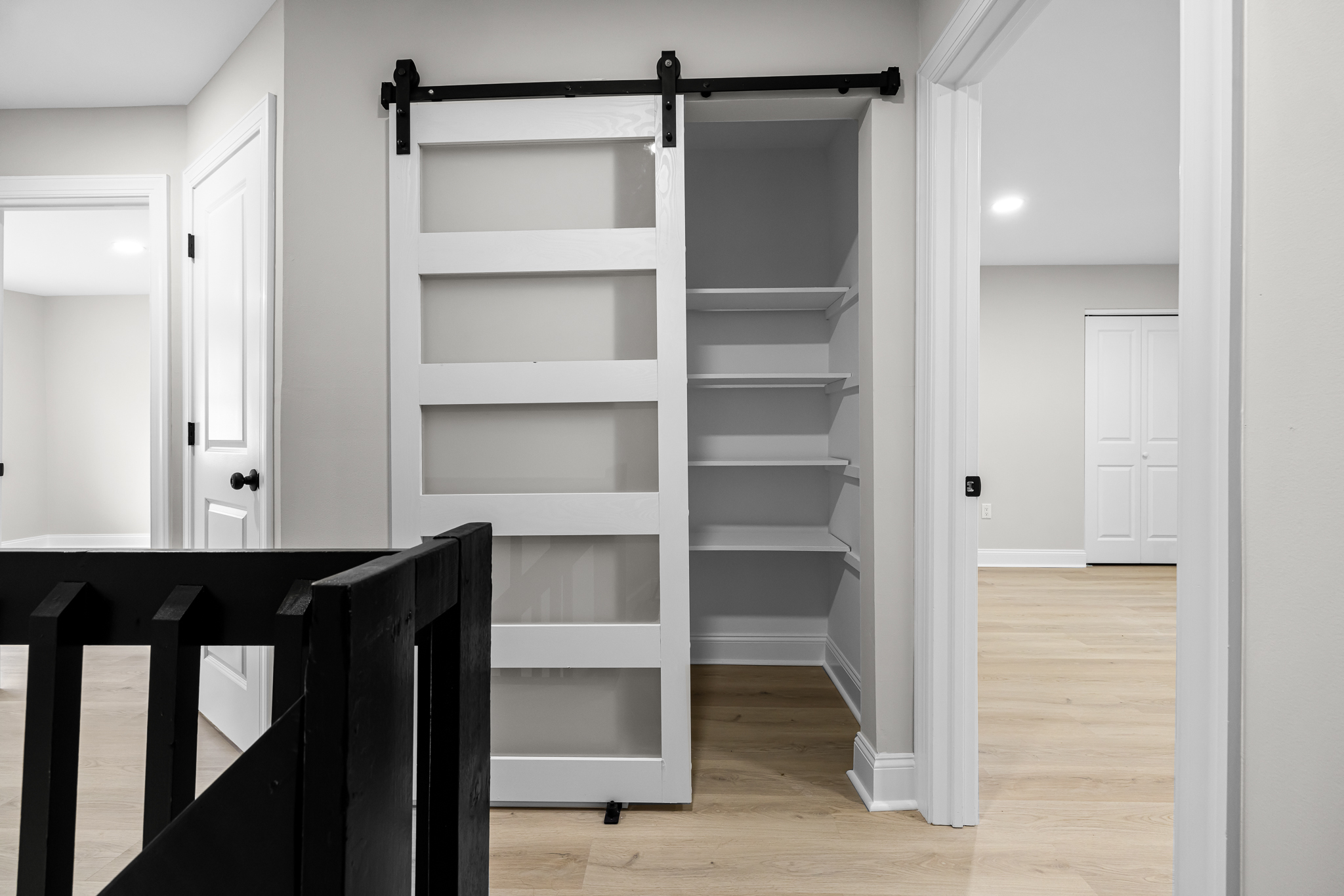 Built-in storage with barn-style sliding door