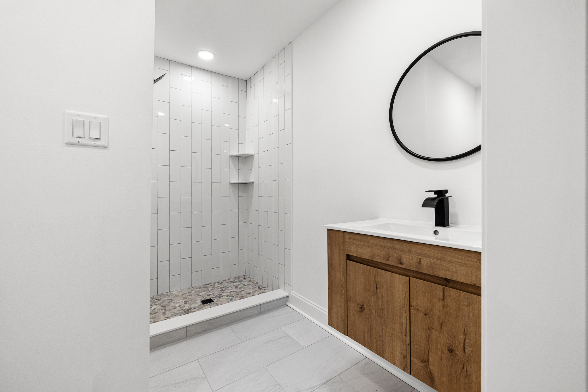 Modern bathroom with walk-in tiled shower