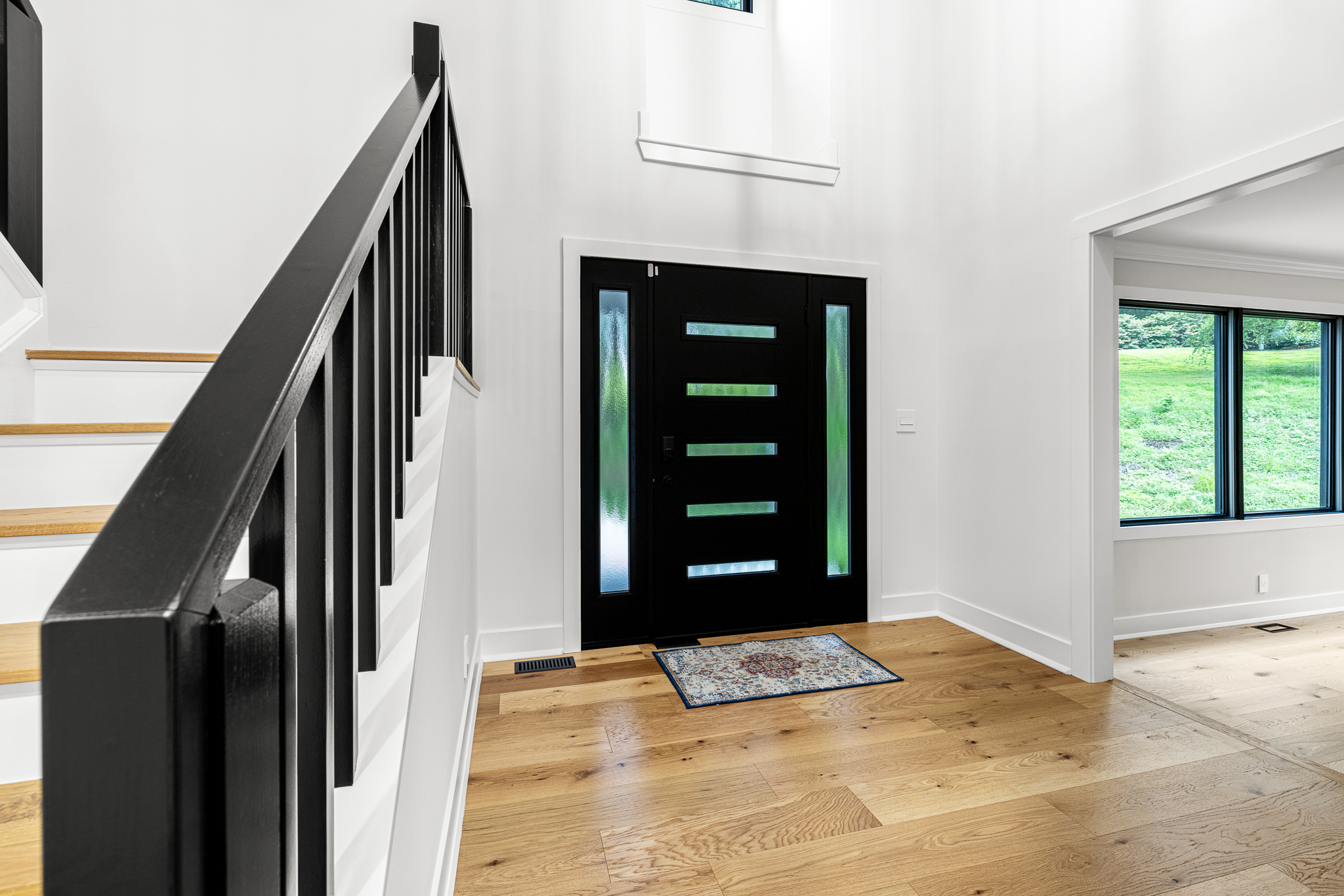 Updated interior with cohesive flooring and paint