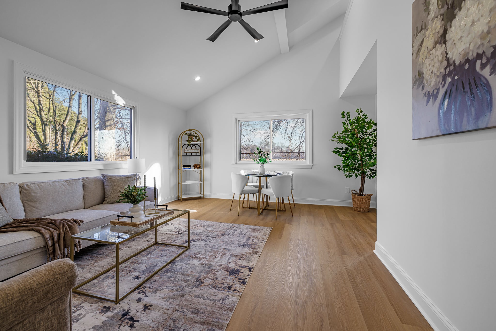 Bright open living and dining space with refined finishes