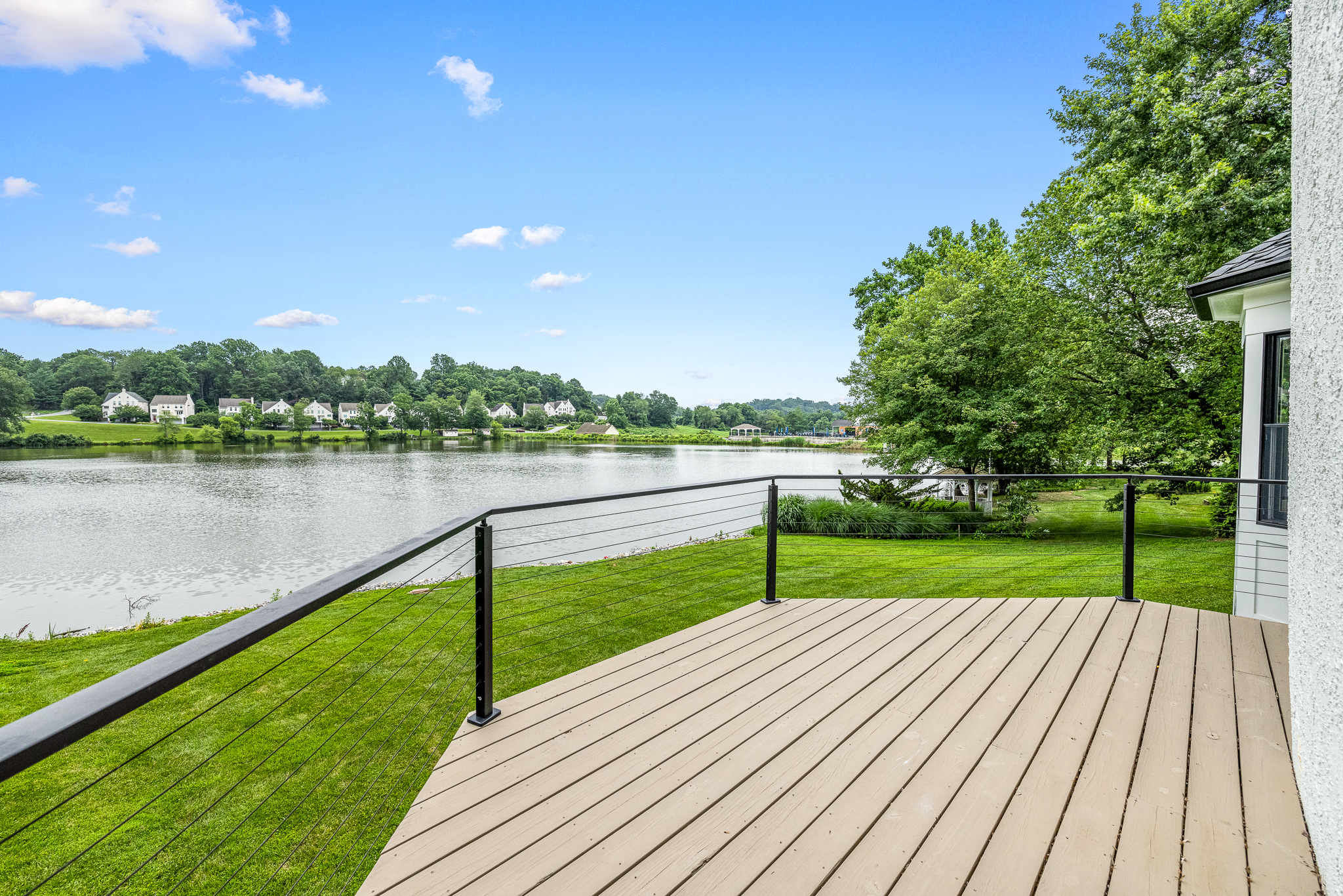 Deck overlooking water with cable railing