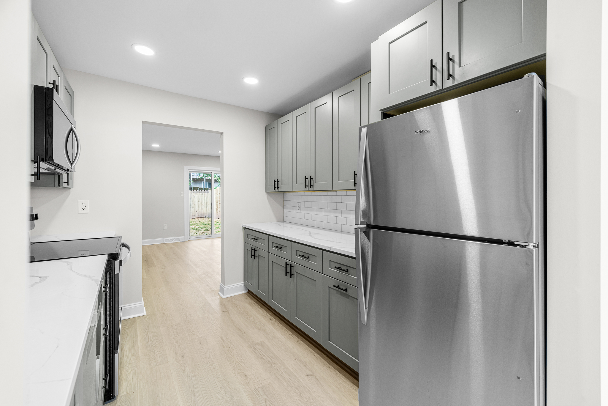 Modern galley kitchen with gray cabinetry